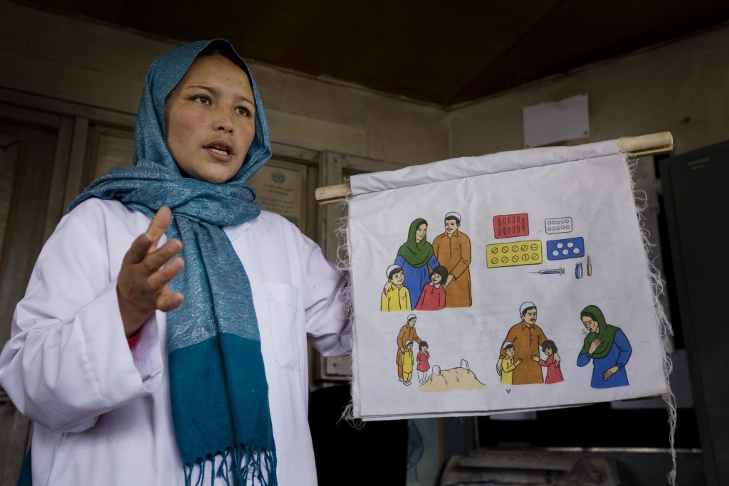 Community health worker in Afghanistan giving a presentation